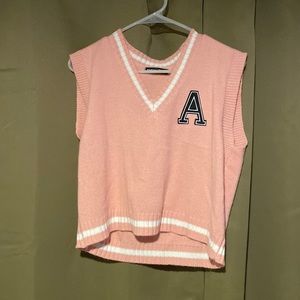 Pink letterman’s vest